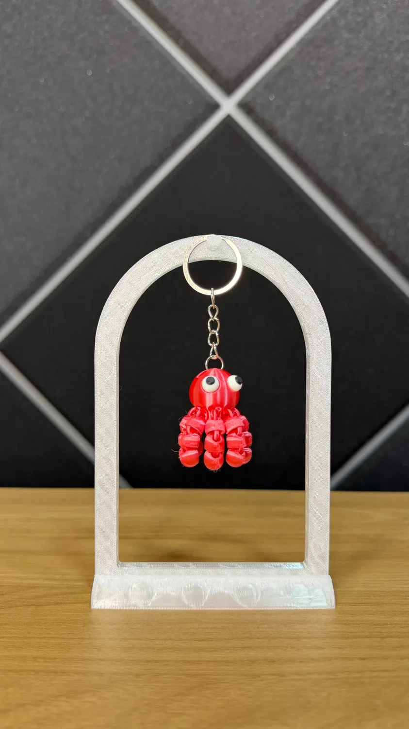 Chaveiro de polvo articulado rosa impresso em 3D